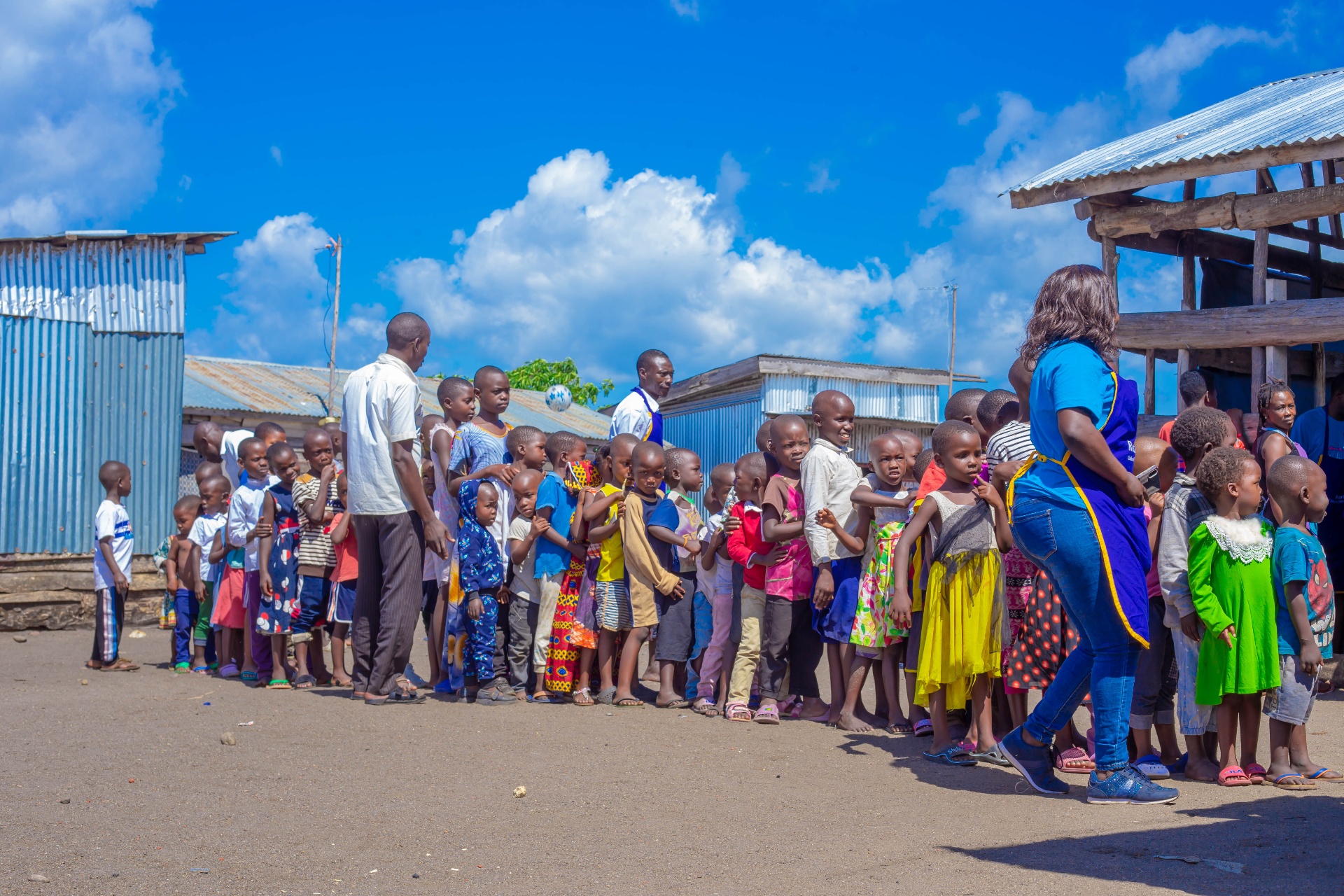Children of Kimi Island lined up during a Kimmi Restoration Campaign community outreach day