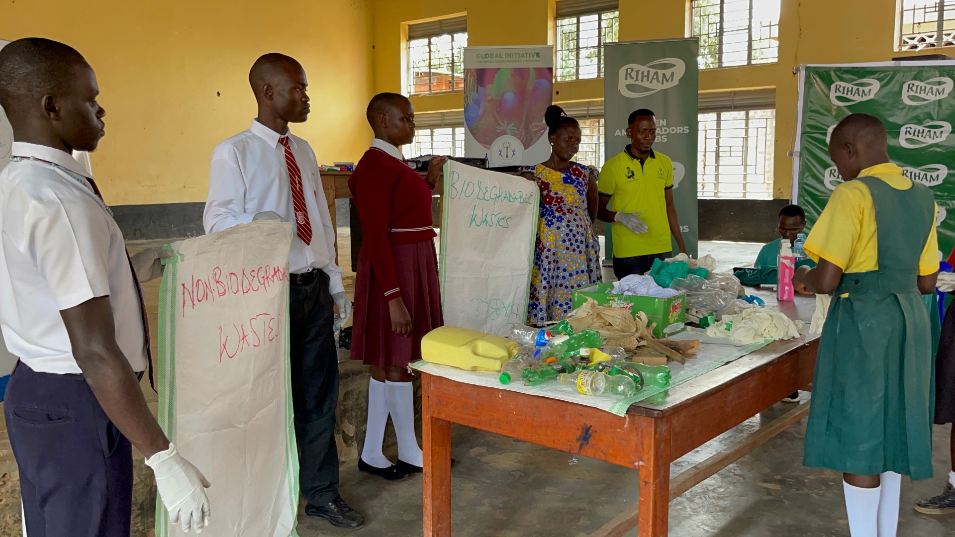 Students sorting biodegradable and non-biodegradable waste during a Riham Green Ambassadors Club school session